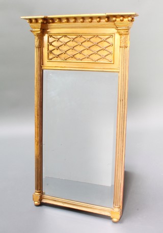A Regency rectangular bevelled plate pier mirror with ball studded and fret work decoration supported by 2 columns 43" x 24 1/2" 
