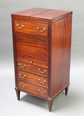 A Georgian mahogany enclosed wash stand revealing a mirror, the base fitted a drawer above cupboard with tambour shutter above 3 long drawers and fluted columns to the sides 42"h x 19 1/2"w x 18"d 