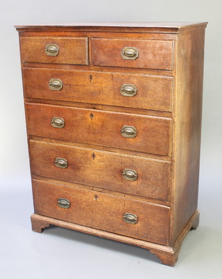 An 18th Century oak chest of 2 short and 4 long drawers with brass plate drop handles, inlaid with diamond shaped escutcheons, raised on bracket feet 60"h x 37"w x 19 1/2"d 