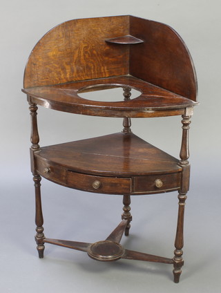 A Georgian oak corner wash stand with raised galleried back, fitted a bowl receptacle above 1 long drawer flanked by 2 dummy short drawers, with undertier 41"h x 29"w x 20"d  