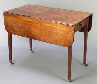 A Georgian mahogany Pembroke table fitted a drawer, raised on square tapering supports brass caps and casters 28"h x 37"w x 19 1/2" when closed x 39" when open 