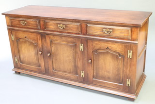 A 17th/18th Century style oak dresser base fitted 3 drawers above 3 cupboards with brass drop handles and H framed hinges, 33"h x 66"w x 21"d 