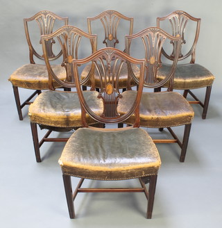 A set of 6 19th Century Hepplewhite style camel back dining chairs with shield shaped backs, the seats upholstered in leather, raised on square tapering supports with H framed stretcher 