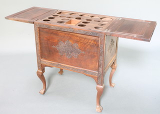 A Burmese rectangular carved hardwood surprise cocktail cabinet with hinged lid, raised on cabriole ball and claw supports 29"h x 24"w x 17"d 