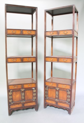 A pair of Chinese hardwood what-nots fitted 4 short drawers above double cupboard 74 1/2"h x 21 1/2"w x 14"d 
