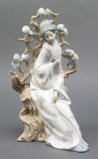 A Lladro figure of a Japanese lady holding a fan sitting before a tree 12" boxed