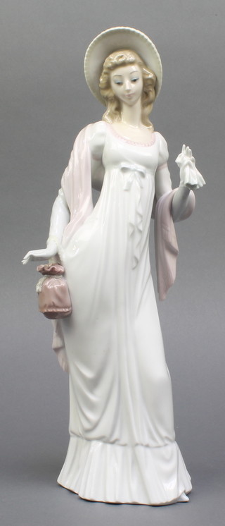 A Lladro figure of a standing lady 13" boxed