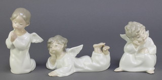3 Lladro figures of angels, 1 kneeling, 1 sitting down and 1 laying down