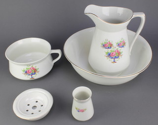 A wash set comprising jug, bowl, chamber pot, toothbrush holder and soap dish, the transfer decoration with floral bouquets 