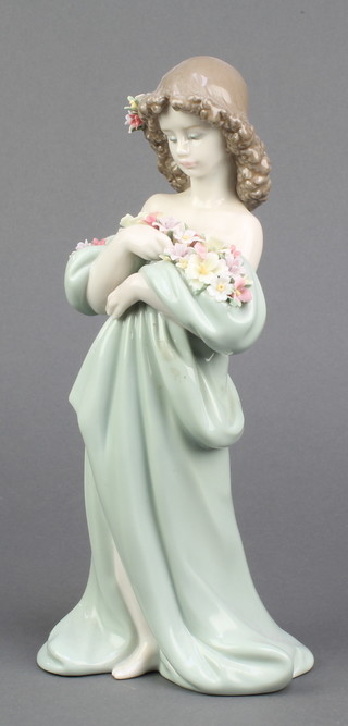 A Lladro figure of a young lady holding spring flowers in her dress 6346 10" 
