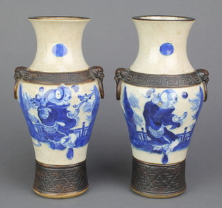 A pair of early 20th Century crackle glazed oviform vases decorated with figures on pavilion terraces 9" 