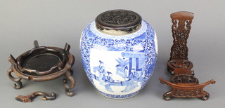 A Chinese early 20th Century blue and white ginger jar and cover decorated with panels of figures on a pavilion terrace, flowers and classical motifs, double ring mark to base and hardwood mounts 8" 