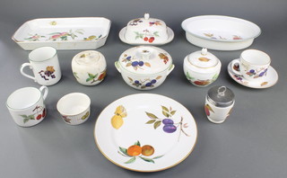 A Royal Worcester Evesham tea, coffee and dinner service comprising 9 small tea cups, 5 coffee cups, 5 mugs, 2 large tea cups, 6 small saucers, 5 large saucers, 8 small plates, 10 medium plates, 13 dinner plates, 15 side plates, 5 soup bowls, 2 cream jugs, 1 milk jug, 1 butter dish and cover, sauce boat, 2 bowls, 6 small 2 handled dishes, 6 cereal bowls, 6 casserole bowls, a lidded bowl, egg coddler, a sugar bowl and lid, 3 dishes, 10 ramekins and a flan dish 