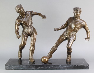 A bronzed figure group of 2 footballers raised on a rectangular black veined marble base 19"h x 24 1/2"w x 7 1/2"d 