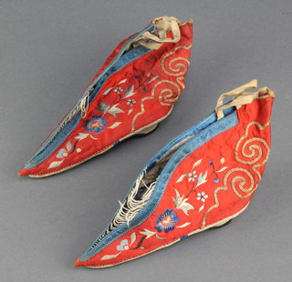 A pair of Chinese red silk and embroidered shoes 4 1/2" 
