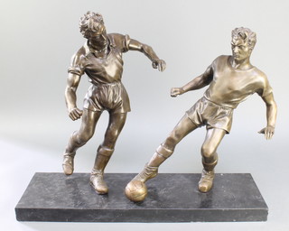 A bronzed figure group of 2 standing footballers, raised on a rectangular black marble base 20"h x 24"w x 7 1/2" 