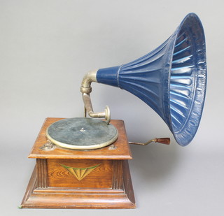 A horn gramophone with pressed metal horn and oak case
