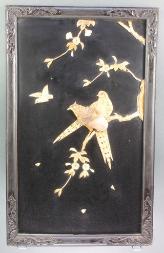 A pair of Japanese rectangular lacquered panels inlaid ivory and mother of pearl depicting birds amidst branches 26 1/2" x 16"
