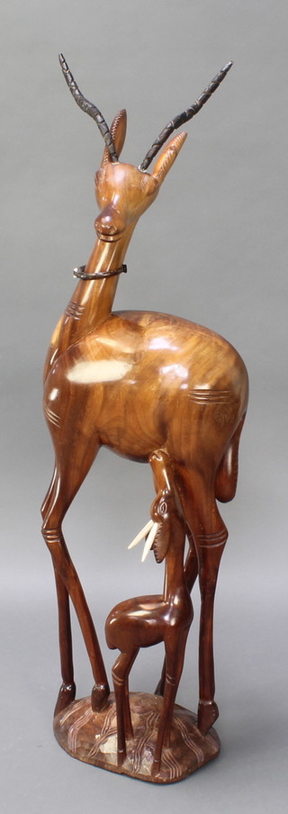 An African carved hardwood figure of a standing gazelle and calf 14"h 
