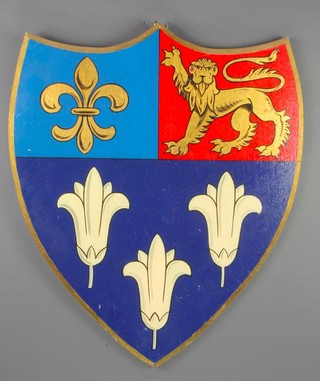 A wooden shaped and painted armorial shield 24" x 20 1/2" 
