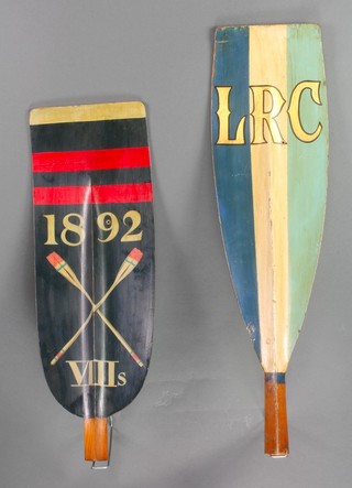 A painted wooden oars head marked LRC 26 1/2" and 1 other marked 1892 with crossed oars XIII S 22 1/2" (both have holes) 