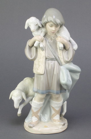 A Lladro figure of a shepherd and sheep 5485, 8" 