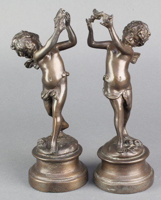 A pair of bronzed figures of cherubs 9" 