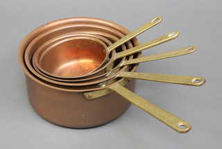 5 graduated copper saucepans with brass handles 8", 7", 6", 5 1/2", 4 1/2" 