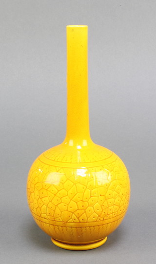 A Victorian Burmantoft style aesthetic orange glazed bottle vase with scale decoration 8" 