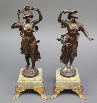 A pair of 19th Century spelter figures of standing classical ladies raised on green marble bases 14"  (1 f and r)