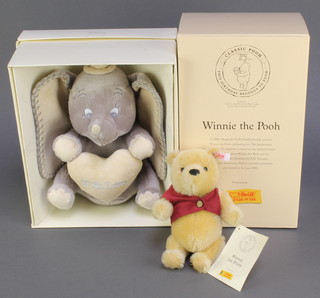 A Steiff 2001 70th anniversary of Winnie The Pooh bear 7" and a Classic Disney Magical Beginnings figure of Dumbo 9" 