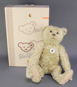 A 1908 replica Steiff Club bear with articulated limbs 17" with growler 
