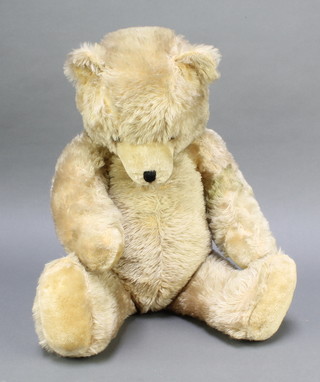 A yellow teddybear with articulated limbs 25" 