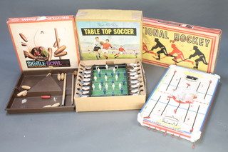 An Aurora skittle-bowl, a Tudor Rose table top soccer game (box damaged) and a Canadian National hockey game 