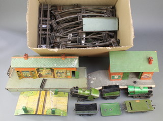 A Hornby clockwork locomotive type MO (f) together with 1 other (dented), a metal platform and ticket office, various rails 