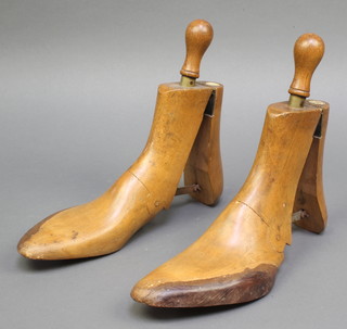 A pair of 19th Century beech and brass patented shoe trees marked Peals "SP Tree" 487 Oxford Street London 