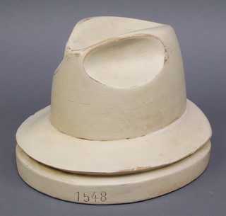 A wooden Homberg hat form marked 56 