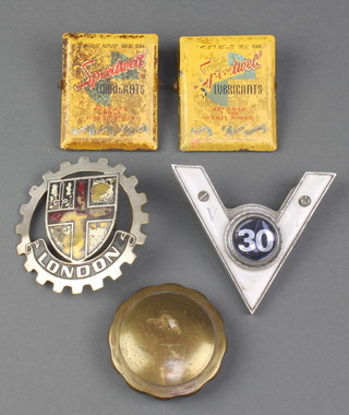 A pierced London radiator badge, a Motorist radiator badge, 2 enamelled Speedwell lubrication bulldog clips, a brass radiator cap