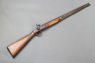An 18th/19th Century muzzle loading percussion rifle with 26 1/2" barrel and ram rod  
