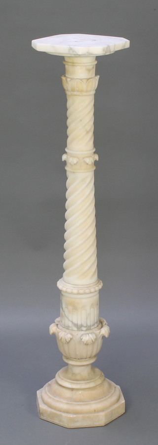 A Victorian carved marble jardiniere/torchere stand with fluted column and octagonal top 42"h x 9"w x 8 1/2"d 