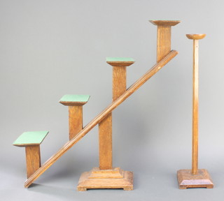 A turned oak milliners display stand raised on a square base 22"h together with an Art Deco stepped oak milliners display stand 24"h 
