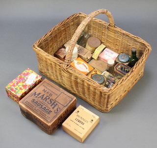 A rectangular butcher's basket 11"h x 27"w x 23"d containing a M&B Marsh's Famous Cambridge Sausage box and other items of packaging