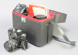 A Zenith  E M camera with Helios 1:2.8 lens, a Helios-44mm 2/58 lens, an Intercity auto lens 1:5.5 F=80-20mm no.C-85401 lens with carrying case 
