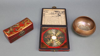 A Chinese Feng Shui compass contained in a lacquered box, a rectangular Chinese pillow box with hinged lid 2 1/2" x 2 1/2" x 7" and a circular Chinese bronze inlaid white metal bowl decorated animals 3" x 5 1/2" 