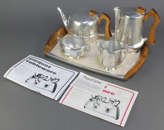 A 5 piece Picquot tea service comprising rectangular twin handled tea tray, teapot, hotwater jug, milk jug and sugar bowl together with a Picquot Ware catalogue 
