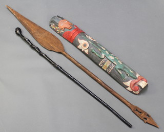 A carved African shield 38" x 6", a carved dance spear/paddle (blade damaged) and an "ebony" walking stick the handle in the form of a bust 