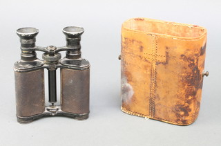 A Chatelain, a pair of French binoculars with leather carrying case  
