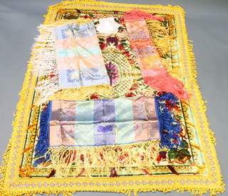A yellow chenille table cloth 83" x 59", 3 Indian silk embroidered table cloths with deep fringes 32" x 31 1/2" , 32" x 32 1/2", 32" x 34" and 8 napkins