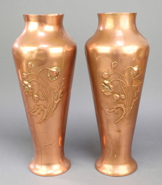 A pair of WMF Art Nouveau embossed copper vases decorated poppies 15"h x 10" diam., the mase marked with running bird mark 