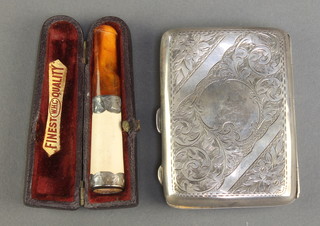 A silver cigarette case with chased scroll decoration Birmingham 1911, 62 grams, a silver mounted cigar holder cased 